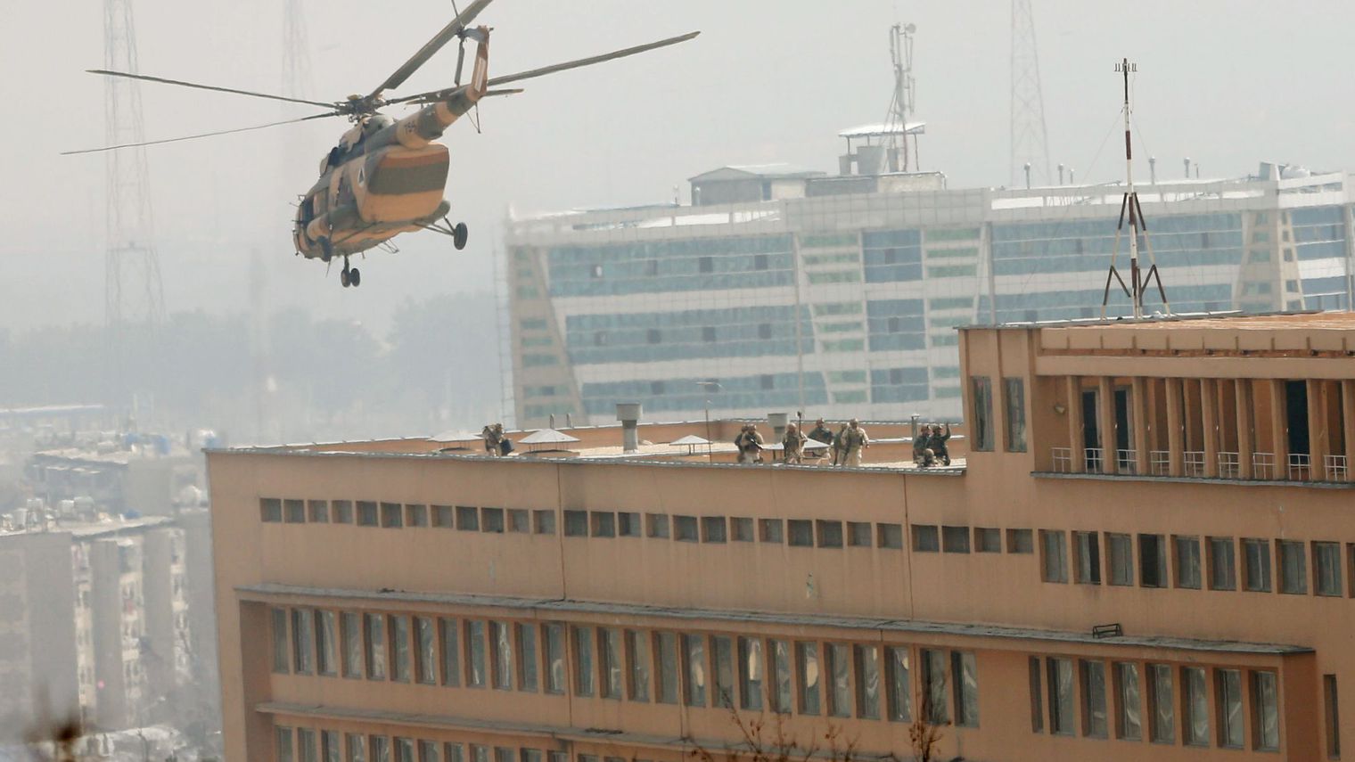 afghan-national-army-ana-soldiers-descend-from-helicopter-on-a-roof-of-a-military-hospital-during-gunfire-and-blast-in-kabul-afghanistan_5839179.jpg