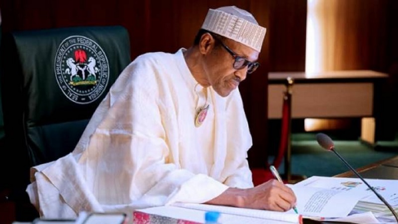 President Buhari signs